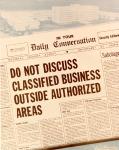 cx-7355-034.jpg-The front page of a newspaper called "In Your Daily Conversation."  The headline of the paper says, "Do Not Discuss Classified Business Outside Authorized Areas."

